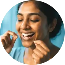 Flossing for Healthy Gums Person demonstrating proper flossing technique to maintain healthy gums.